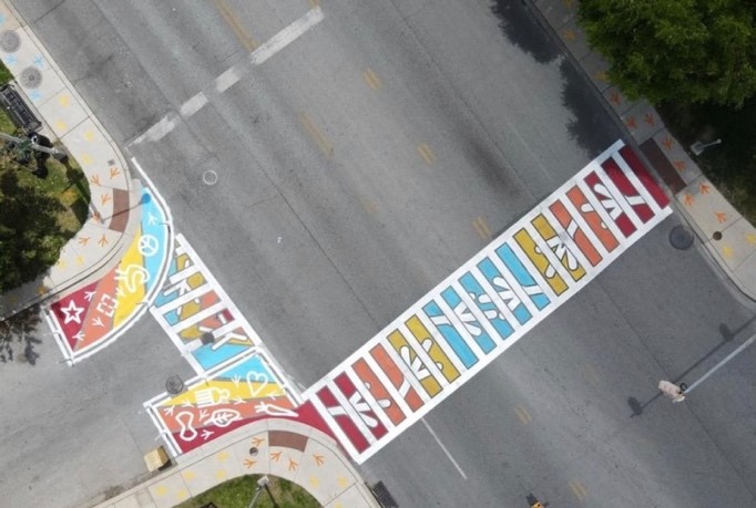 Aerial view of an intersection with colorful crosswalk to help increase pedestrian safety